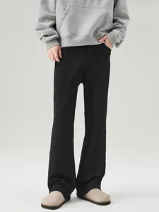Men's stylish black flared casual trousers featuring a clean fit and relaxed drape style