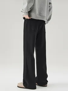 Men's cleanfit black flared jeans with back pocket detail and relaxed silhouette