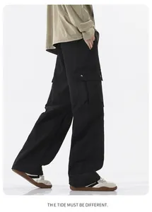 Detail of waterproof cargo pants featuring flap side pockets and a straight-leg fit