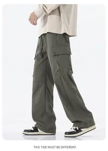 Detail of army green outdoor tactical cargo pants with large flap side pockets