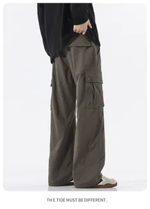 Detailed side view of dark brown cargo pants featuring functional large side pockets