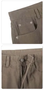 Detailed close-up of brown heavy twill cotton pants featuring branded LOCKETOMY buttons