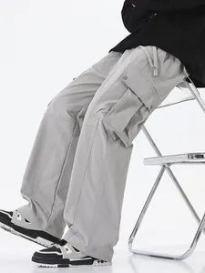Men's outdoor grey waterproof cargo pants with loose fit and side flap pockets