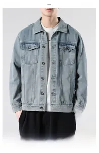 Detailed shot of breathable light blue washed denim jacket with premium metal buttons