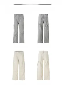 Detail view of high street vintage washed cargo pants in light gray and off-white colors