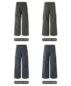 Flat lay detail of vintage washed cargo pants with utility pockets in dark green and grey