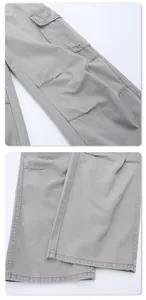 Detail shot of cargo flap pockets and durable stitching on light grey vintage trousers