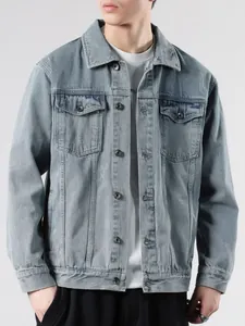 Men's washed moon blue denim jacket with classic collar and breast pockets on a model