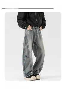 Detailed view of vintage blue washed denim fabric texture and loose fit tailoring