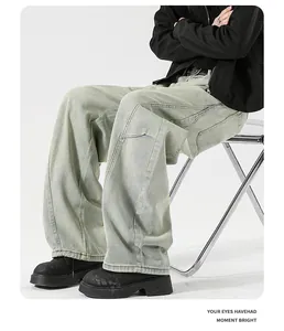Close-up of vintage washed denim jeans with a wide-leg silhouette and baggy streetwear fit