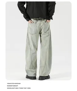 Detail view of American vintage washed green jeans with back pockets and curved seam stitching