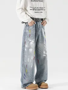 Retro graffiti wide-leg jeans with colorful spray paint art and distressed washed finish