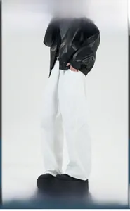 Side view of men's white wide-leg trousers with a relaxed straight cut and twill texture