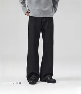 Detail of loose straight fit dark denim pants with warm fleece lining for men