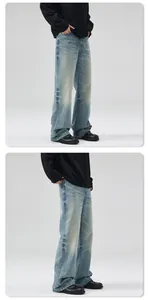 Detail of vintage washed light blue flared jeans showing fabric texture and drape