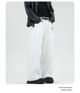 Close-up of white wide-leg denim jeans with high-waist cut and structured fabric finish