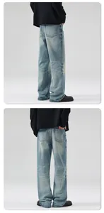 Detail of vintage washed blue denim jeans showing back pockets and faded whiskering