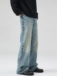 Vintage wash light blue wide-leg jeans with whiskered texture for men and women