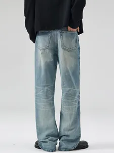Vintage washed light blue flared jeans for men and women with whiskers and rear pockets