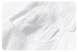 Macro shot of white denim fabric showing reinforced stitching and rectangular patch pocket detail