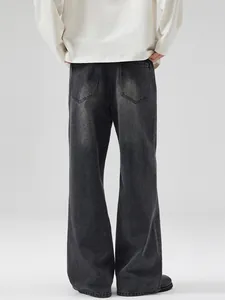 Jean large délavé noir pour homme avec poches arrière et texture vintage effet flocon