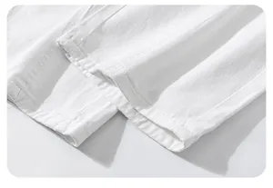 Close-up of white vintage washed denim with double-stitched seams and cotton twill texture