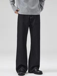 Classic loose fit straight leg dark indigo denim jeans with contrast yellow stitching