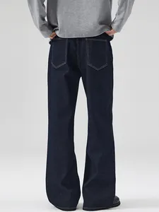 Classic dark blue raw denim straight-leg jeans with contrast stitching for men