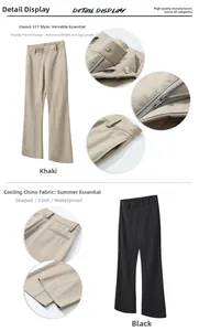 Detail of flared trousers showing metal hook waist closure and waterproof fabric texture