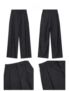 Dettaglio dei pantaloni neri a gamba larga con pieghe che mostra vita e tasche