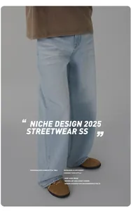 Detail of light blue straight denim pants featuring vintage faded whisker wash patterns