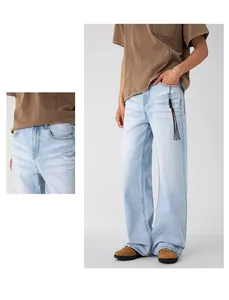 Detail of light blue straight-leg jeans featuring cat-whisker wash and high-waist cut