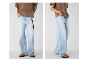 Detail view of glacial blue straight-leg denim jeans with washed finish and metal accessory