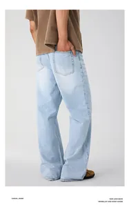 Detail view of glacial blue straight-leg denim jeans with relaxed fit and vintage wash