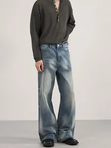Men's vintage washed blue flared jeans with relaxed fit and minimalist cleanfit aesthetic