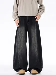 Vintage washed black baggy jeans with central seam detail and wide leg streetwear fit