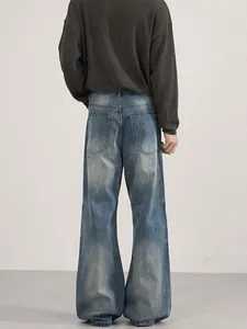 Retro washed blue wide leg jeans for men with vintage fading and loose fit style