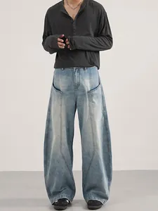 Men's light blue washed baggy jeans with 3D panelled design and oversized cargo pockets