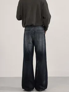 Deep blue wide-leg wash-effect denim jeans in cleanfit style with relaxed back view