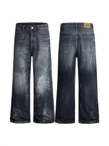 Deep blue washed flare jeans with vintage dye effect and brown leather waist patch