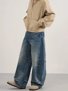 Men's khaki zip jacket and washed vintage blue wide-leg jeans with a retro street fit