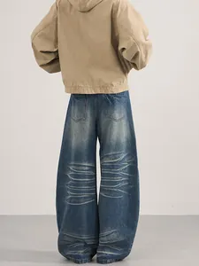 Retro washed wide-leg blue denim jeans with back whiskering details and loose fit for men