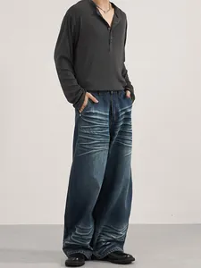 American style wide-leg jeans with whiskered detail and vintage washed dark blue finish