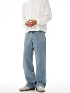 Men's light blue straight-leg jeans with vintage ink splatter design and loose fit