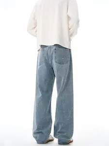 Men's retro light blue washed wide-leg jeans with white ink splatter, back view