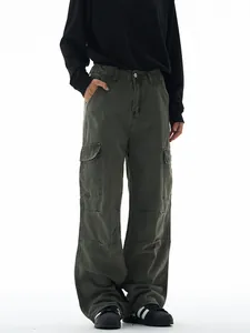 Vintage olive green wide-leg cargo pants with large side pockets and high waist