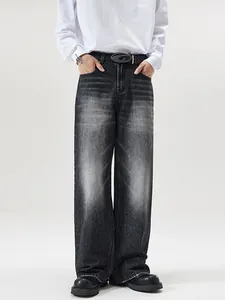 Men's vintage washed black loose fit wide leg denim jeans with cat-whisker texture