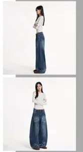 Nahaufnahme der dunkelblauen Baggy-Jeans mit Vintage-Waschung und Catface-Effekten