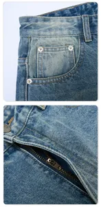 Detail shot of light blue denim jeans showing metal zipper, rivets and wash texture