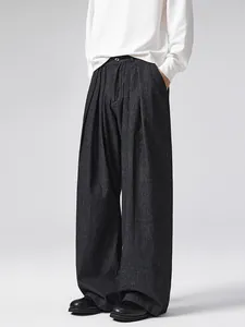Dark gray wide-leg vertical striped trousers with high-waist pleated design and relaxed fit